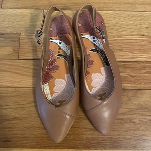 Brown leather slip on mules.